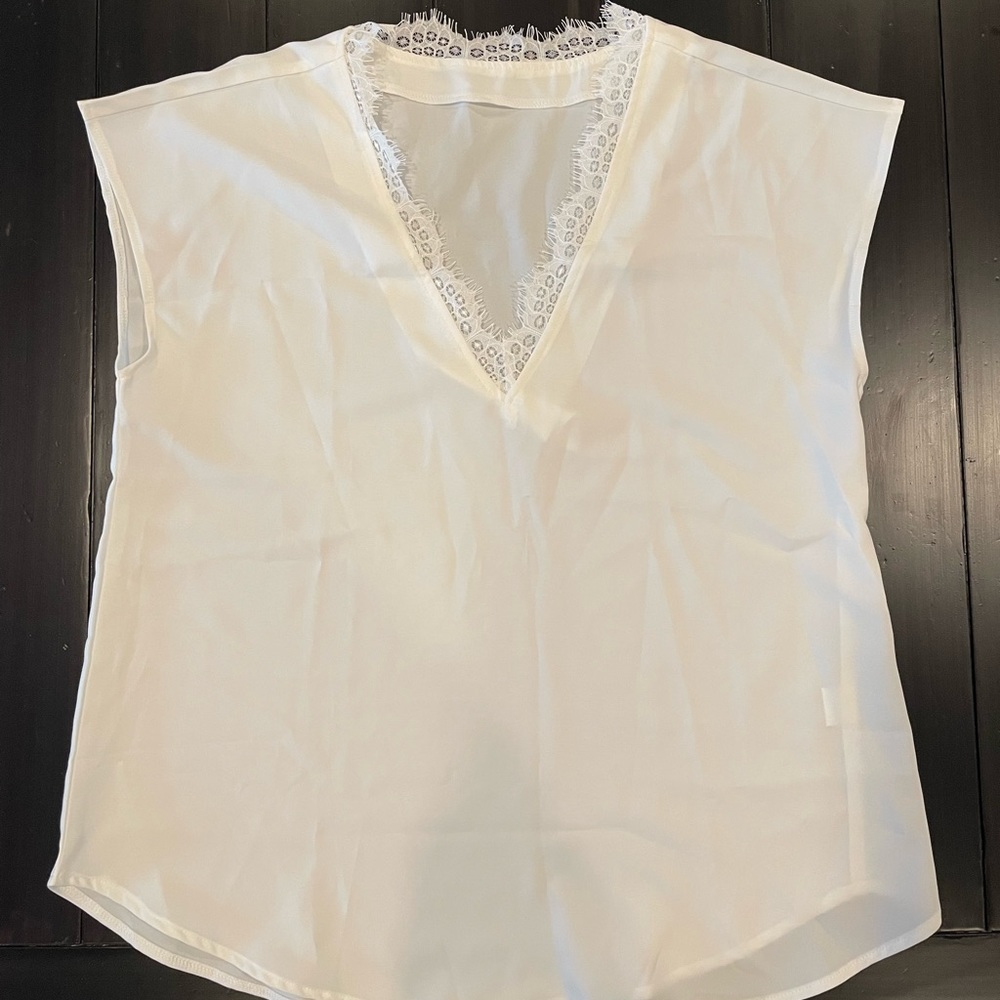 Medium white short sleeve shirt with lace accent around the neck. - Picture 1 of 1